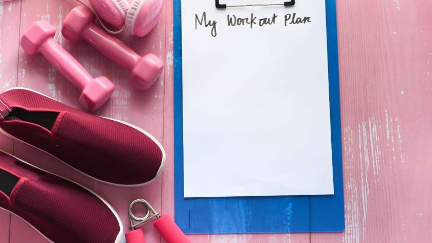 workout plan concept dumbbell shoe and water bottle