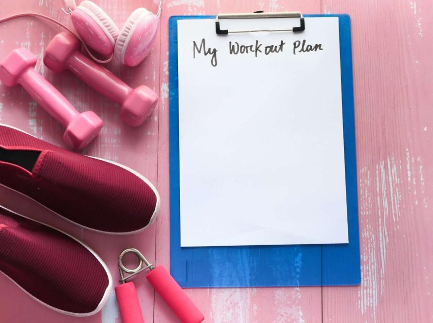 workout plan concept dumbbell shoe and water bottle