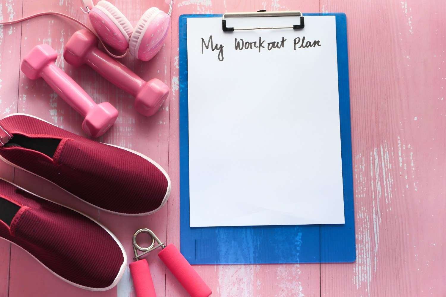 workout plan concept dumbbell shoe and water bottle